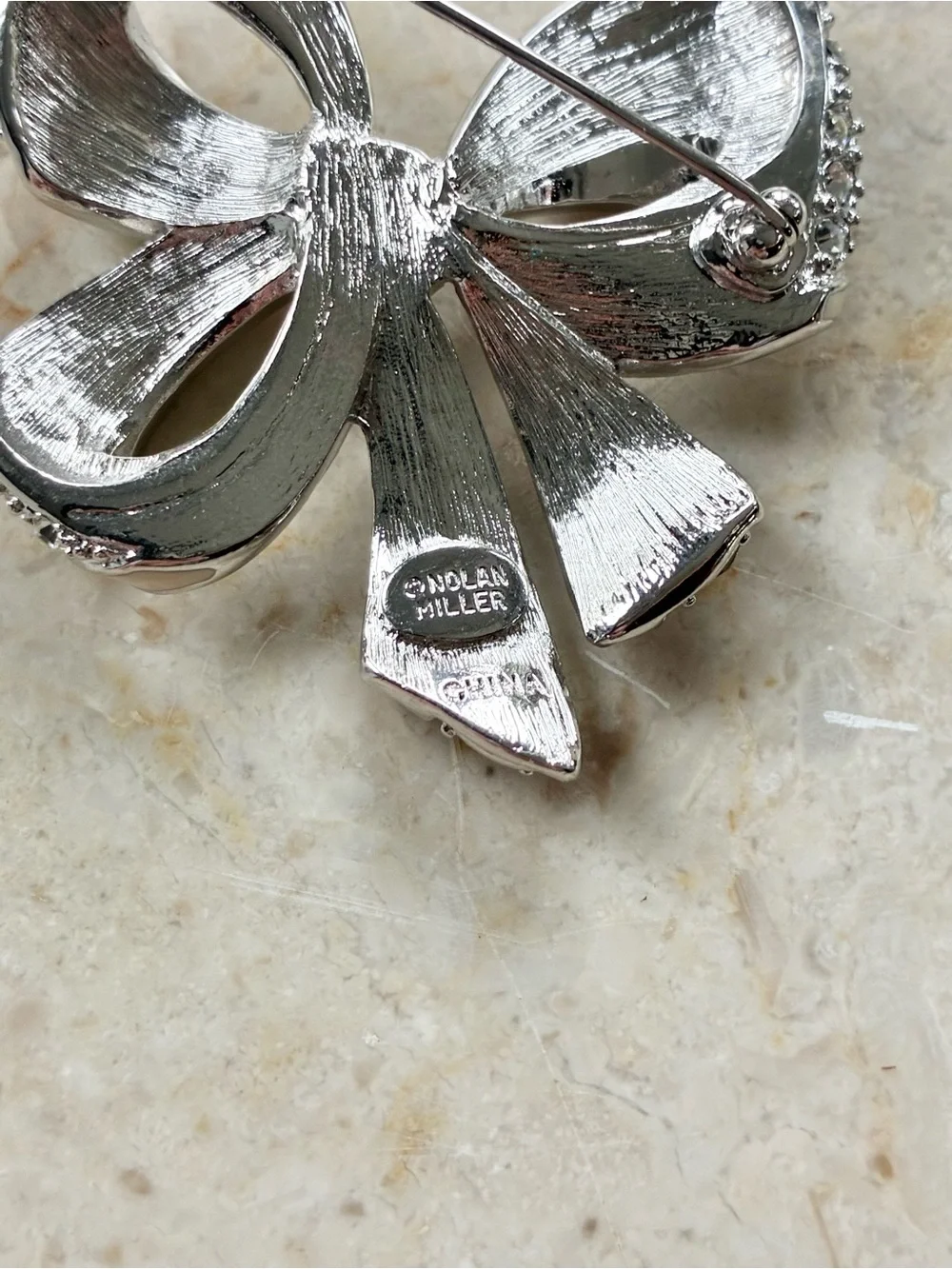 Nolan Miller Shining Spirit Bow Brooch Pin Vintage Silver Tone Rhinestones